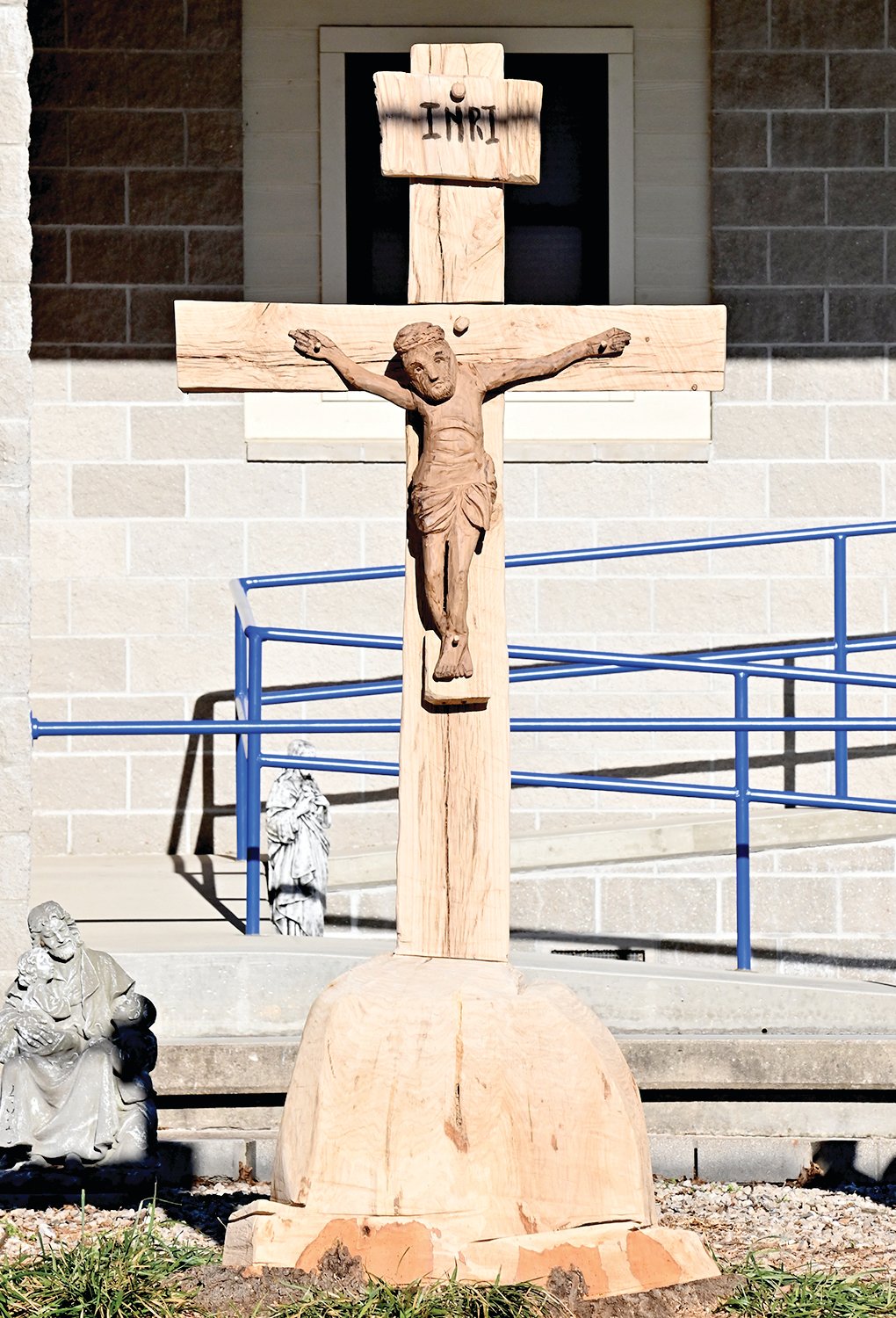 Part of the old tree has been carved into a crucifix. “It’s the Easter story retold. Great beauty has come out of something that has died,” said Lisa Grellner, principal of St. George School.